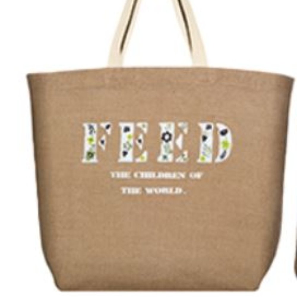 COPY - Free with purchase of more than $100 - NWT Clarins "Feed the children" t…
